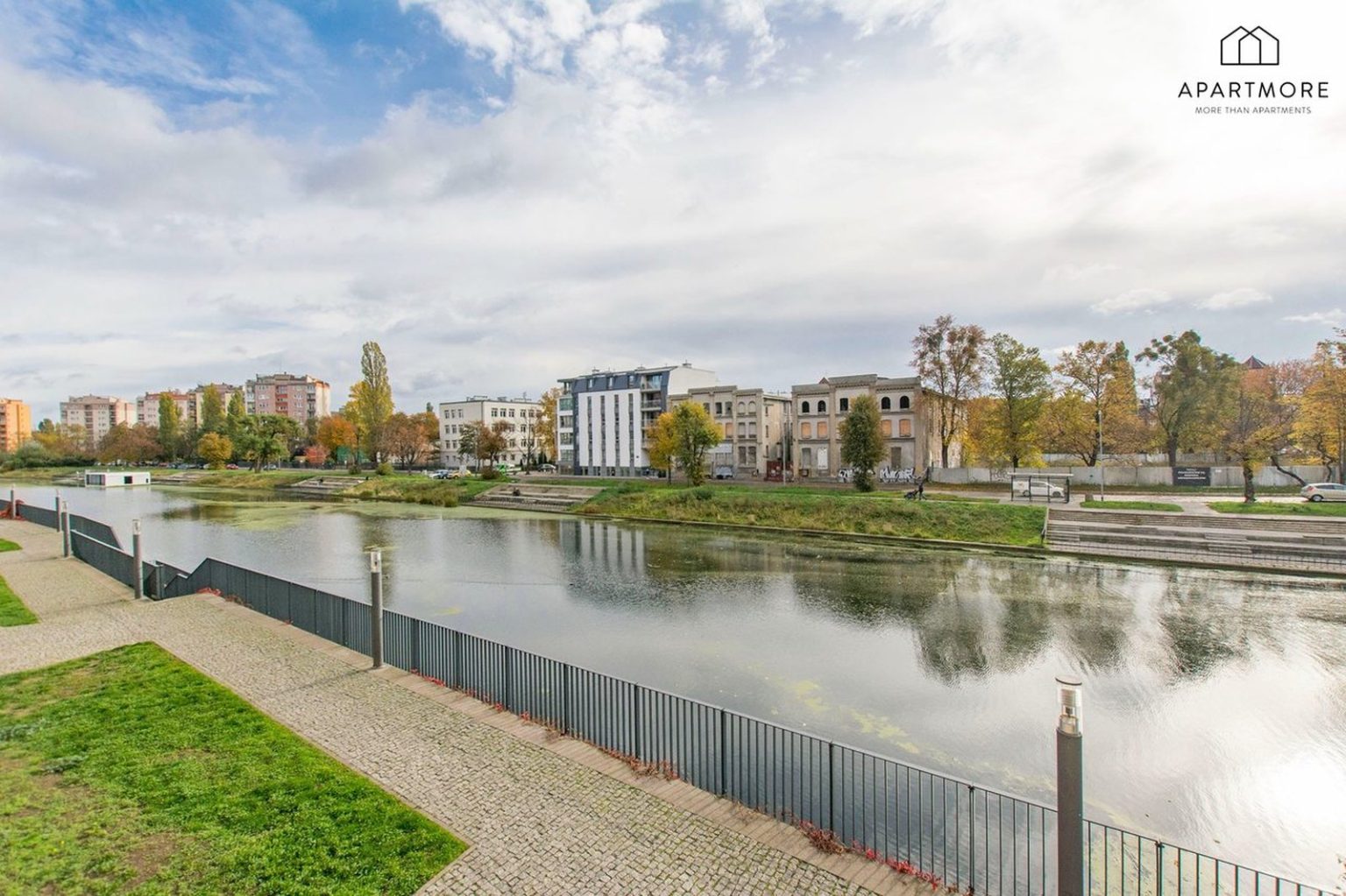 Motlawa riverside in Gdansk in October, autumn trees by the water